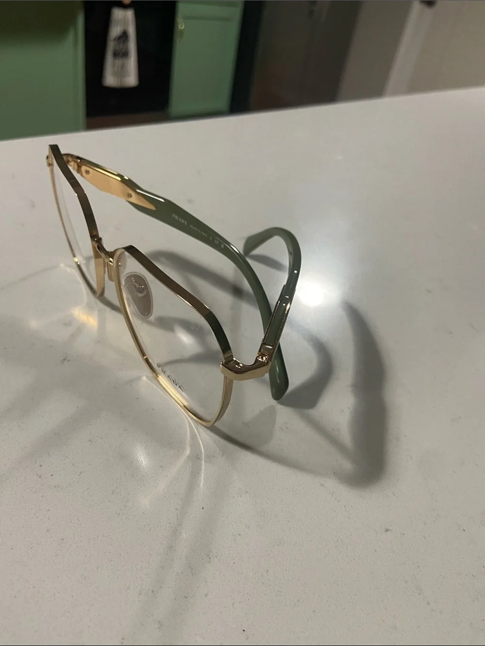 Prada Gold Hexagonal Metal Frame Glasses with Clear Lenses and green arms